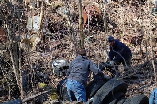 probationers-string-tires-together-to-have-them-towed-out-of-the-dumpsite